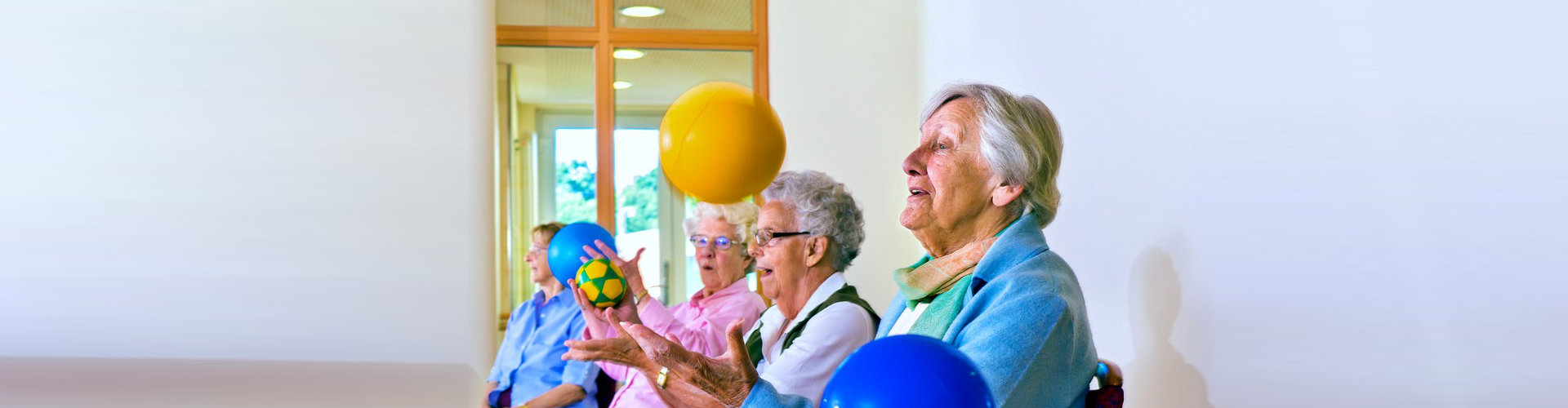 group of senior women playing ball
